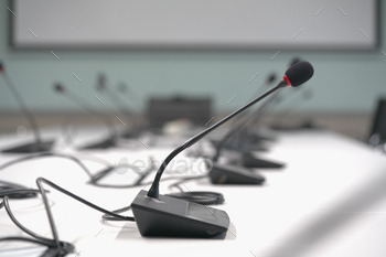 Pack up microphone on desk meeting room.