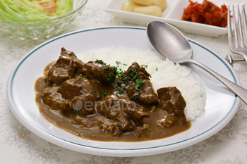 Japanese-vogue red meat curry rice ( curry and rice are served together on the plate)