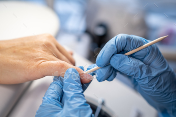 Female arms and instruments for nail filing, technique of performing nail filing