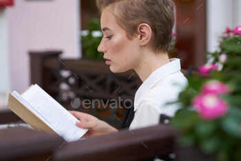 pupil with a e book in his hands studying toddle in the contemporary air Way of life