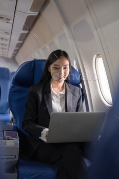 Touring and technology. Flying on the foundation class. Somewhat young Asian industry girl the usage of computer computer