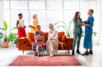 Group of businesswomen assembly inside the design of labor