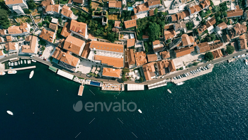 Roam with a swimming pool and a non-public seashore advance outdated properties with crimson roofs. Perast