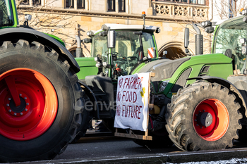 Farmers union yell strike in opposition to authorities Coverage in Germany Europe. Tractors automobiles blocks