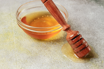 wood spoon with honey, on the desk, spindle for honey, mace , end-up, rustic,