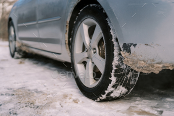 Inspire of the auto with soiled snow shut to the wheel and beneath the physique