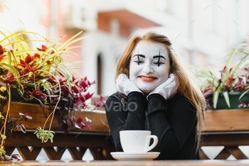 Mime comic ingesting espresso. lady mime drinks espresso in paris.