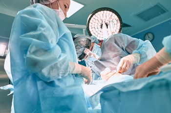 Surgeon carrying gloves operates girls people’s nostril. Operation pack up.