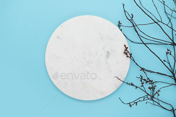 Marble podium with division on blue background