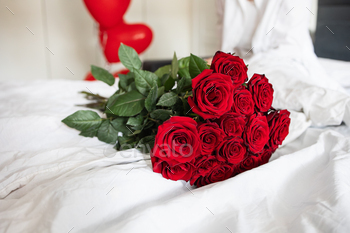 Bouquet of pink roses on the mattress. Reward for cherished woman