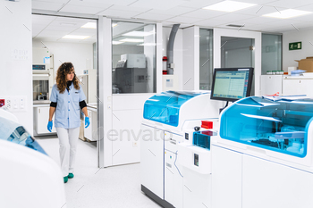 Medical Staff Strolling By means of Medical Lab with Diagnostic Machines