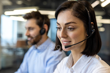 Portrait of smiling younger girl in wi-fi headset and white shirt having a leer forward with smile subsequent