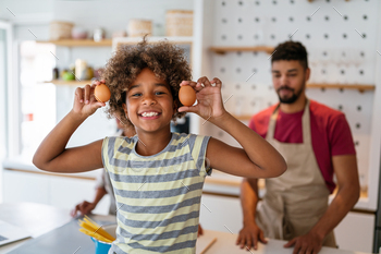 Joyful african american household making ready wholesome meals in kitchen, having pleasant collectively on weekend