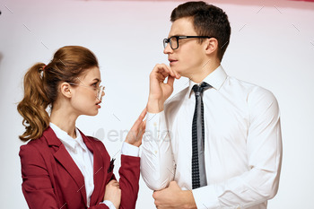 man and lady work colleagues officers verbal change light background