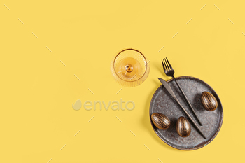 Desk house setting and festive easter decor on yellow background