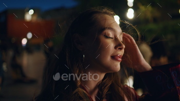 Relaxed woman enjoy celebration at night metropolis freeway pack up. Girl dancing open air