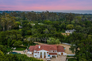 an aerial gaze of a rental stop to the ocean at dusk