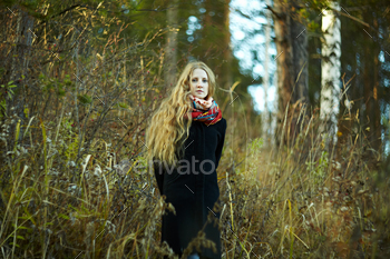 Portrait of younger fairly lady in autumn coat