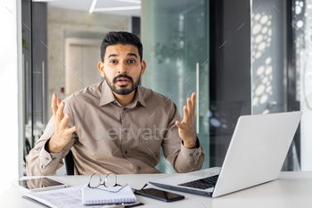 Upset and disenchanted businessman taking a examine digicam at place of job obtained destructive financial outcomes