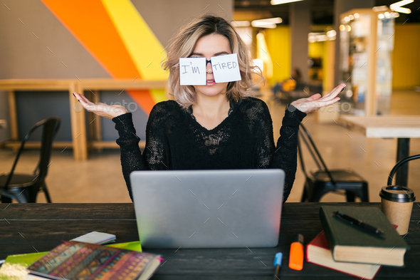 youthful woman engaged on laptop computer in co-working inform of job