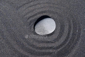 Religion stone on shadowy sand