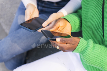 fingers of two women the utilization of cell cellphone