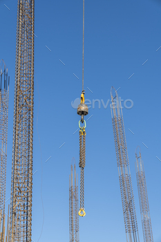 Jib crane improve crane arm in the direction of blue sky background at development zone