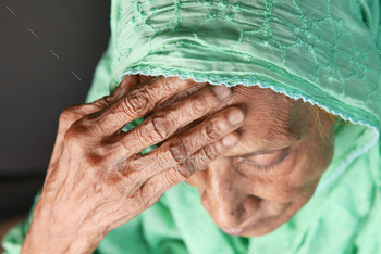 senior lady struggling headache, pack up