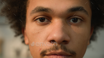 Coarse conclude up portrait African American ethnic man male man taking a stare down conclude eyes conclude stare