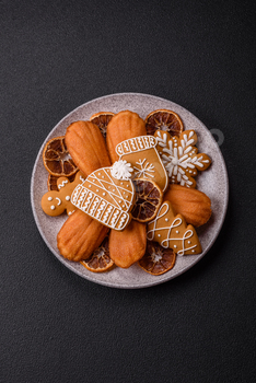 French conventional madeleine sponge cake with solutions of Christmas motifs