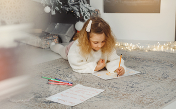 Household Christmas celebration, child gazing for introduction calendar gadgets