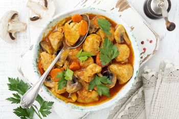 Goulash venerable Hungarian dish. Stew with pepper and tomato sauce in a classic ceramic plate. Se