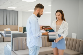 Woman alongside along with her husband on the furnishings retailer showroom