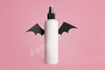 Mockup of a white bottle with bat wings on a crimson background. Halloween concept. Halloween cosmetics