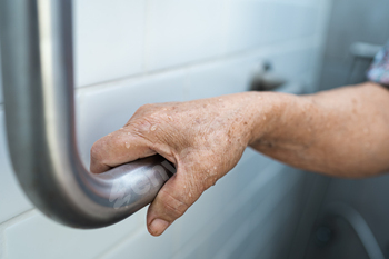 Asian senior or aged outmoded woman woman affected person make the most of toilet toilet handle security