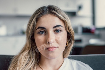 Head shot portrait severe aesthetic younger lady with ideally suited smooth pores and pores and skin having a ogle at digicam